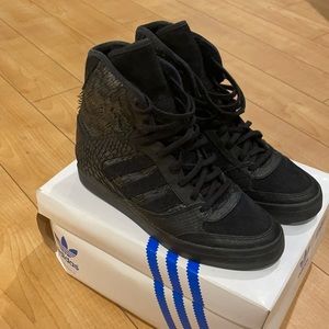 Black high top feathered adidas sneakers